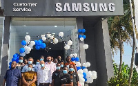 Staff of Electroland Ghana Limited and Samsung in a photo in front of the new Samsung service centre