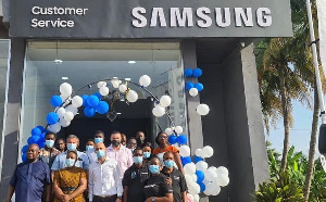 Staff of Electroland Ghana Limited and Samsung in a photo in front of the new Samsung service centre