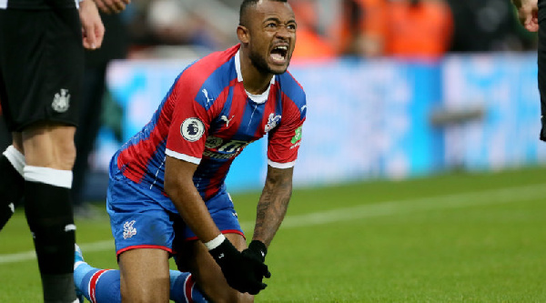 Crystal Palace's Jordan Ayew reacts after a challenge