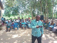 Frank Kwabena Owusu the Municipal Director of Weija-Gbawe CHRAJ interacting with the people