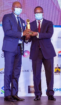 Ben Hassan Ouattara (left)  receiving the award from Maxwell Opoku-Afari