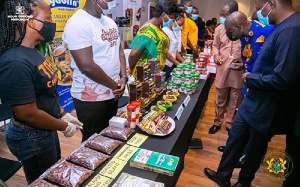 COCOBOD CEO and Information Minister examining some exhibits of cocoa products