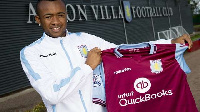 Jordan Ayew displays his new Aston Villa shirt after sealing the 5-year deal