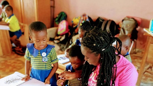 Teacher Ewuraama with some of her pupils