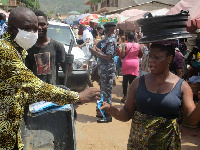 Simon Kweku Tetteh, Lower Manya Krobo DCE with a market woman