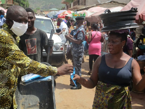 Simon Kweku Tetteh, Lower Manya Krobo DCE with a market woman