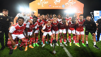 Arsenal players celebrate beating Chelsea