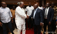 President John Mahama in a handshake with Nana Akufo-Addo