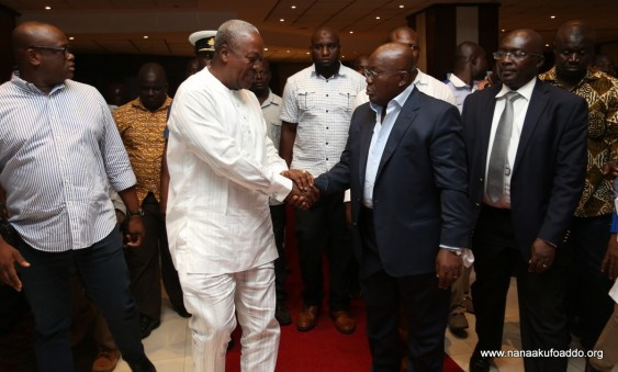 President John Mahama in a handshake with Nana Akufo-Addo