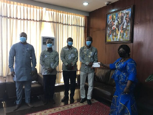 Officials presenting the cheque during their donation exercise