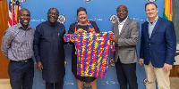 Togbe Afede (second right) presented the jersey the ambassador