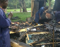 Some workers rummaging through the debris after the fire