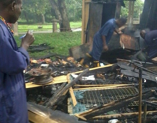 Some workers rummaging through the debris after the fire