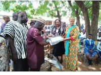 Dr. Hamza Adam presenting street lights to Kumbungu Senior High School