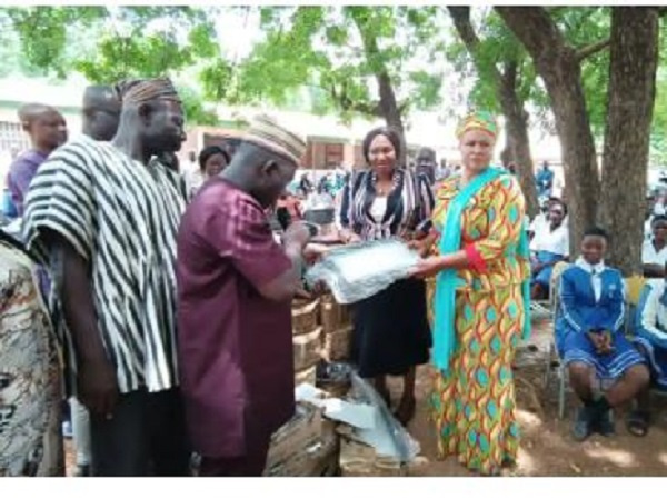 Dr. Hamza Adam presenting street lights to Kumbungu Senior High School