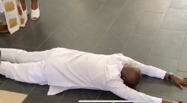 New chairman of the New Patriotic Party laying prostrate