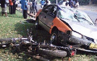 A motorbike knocked down by a taxi