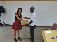 The GM, Nicholas Mensah receiving the prize