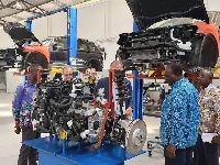 Alan Kyeremanten being briefed by VW officials