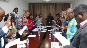 Members of the committee being sworn in