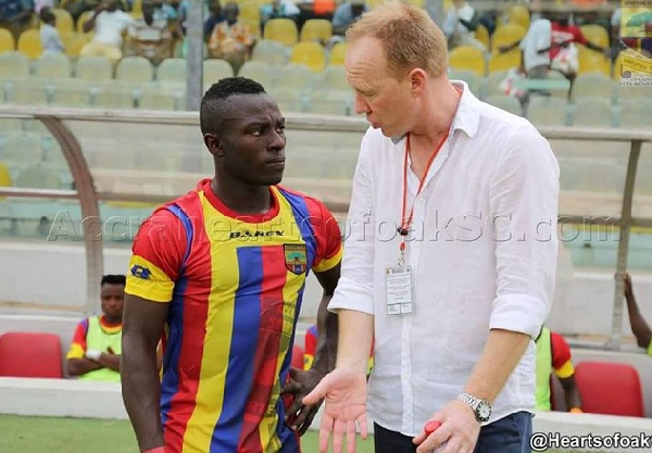 Patrick Razak taking an advice from Coach Frank Nuttal