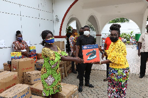 Some hairdressers and seamstresses receiving the equipments