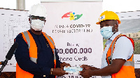 Senyo Hosi receiving the cheque on behalf of the Ghana COVID-19 Private Sector Fund