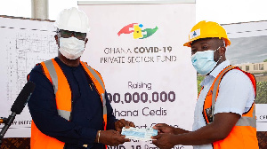 Senyo Hosi receiving the cheque on behalf of the Ghana COVID-19 Private Sector Fund