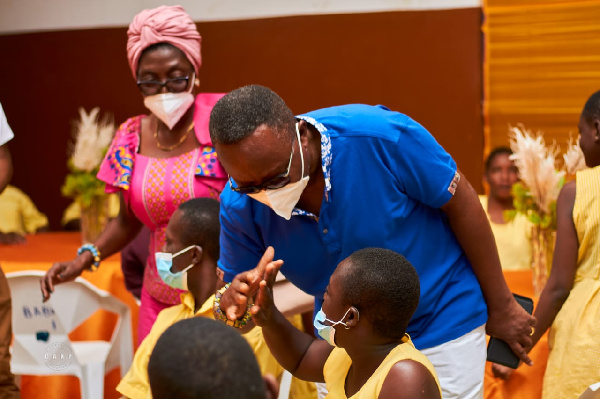 Totobi Quakyi interacting with the children