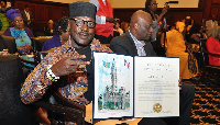 Ambolley shows his citation. Photo by Mr. CNN-3GMedia