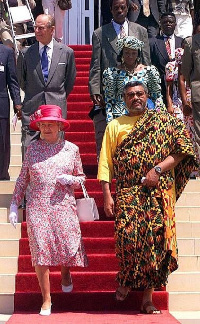 Former President Rawlings escorts Queen Elizabeth when she visited Ghana in 1999