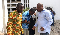 Dr. Obengfo [2nd from left] being assisted to walk at the court premises