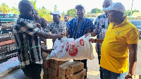 Wilmar Ghana Limited presenting the items to a representative of the Aflao Traditional Council