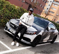 Flashback: Mubarak Wakaso poses in front of his car