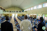 Mohammed Adjei Sowah with some officials of AMA at exams centres