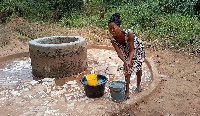 A resident fetching from the well