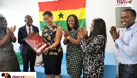 Estelle Akofio-Sowah, Country Manager of Google Ghana admiring an award