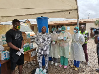 Fatau Dauda presenting the items to the hospital