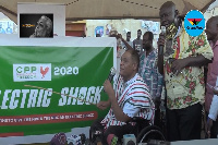 Flagbearer of CPP, Ivor Greenstreet holding a cane during his campaign tour