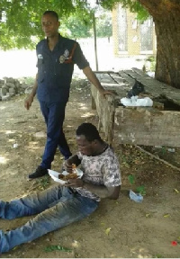 The policeman helping the young man