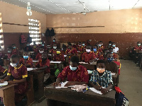 A file photo of students wearing nose masks