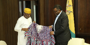 Ghana's High Commissioner to Namibia, Harruna Attah presents a smock to Namibian President