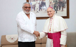 Former President Jerry John Rawlings and Monsignor Jean-Marie Speich