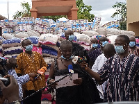 Okyenhene, Osaagyefuo Amoatia Ofori Panin presenting some relief items to some institutions