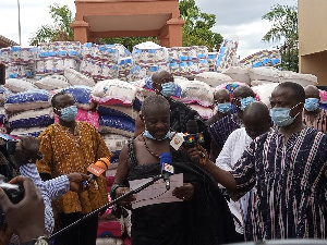 Okyenhene, Osaagyefuo Amoatia Ofori Panin presenting some relief items to some institutions