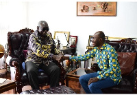 President Kufuor in a handshake with founder of the Awards, Kojo Hayford