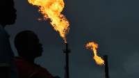 Gas flares burn from pipes at an oil flow station in Idu, Rivers State [Credit Bloomberg]