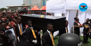 Pall bearers carrying Ebony's casket