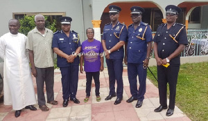 The IGP with others in a group photographer at the home of one the missing girls