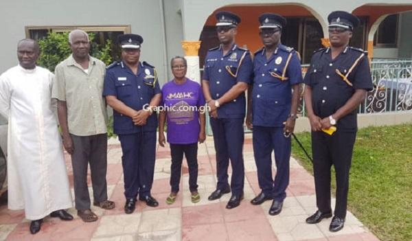 The IGP with others in a group photographer at the home of one the missing girls